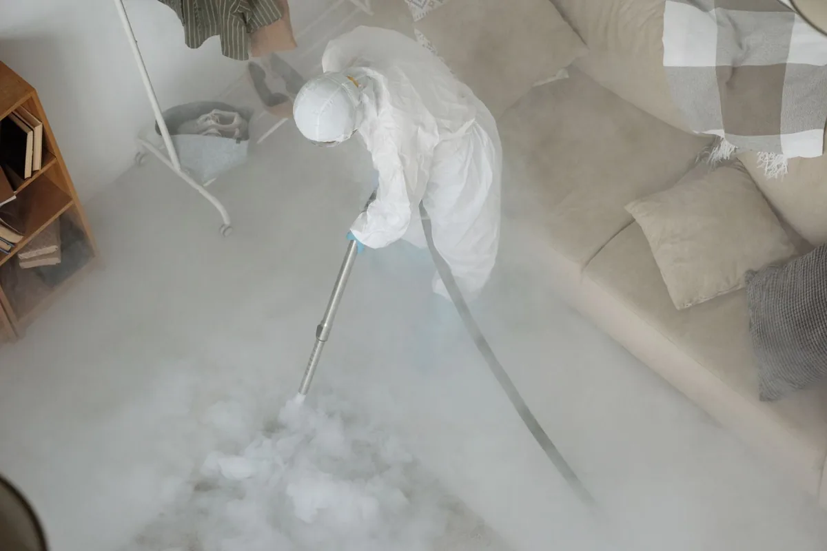 Biohazard cleanup technician in protective equipment, Decatur, AL
